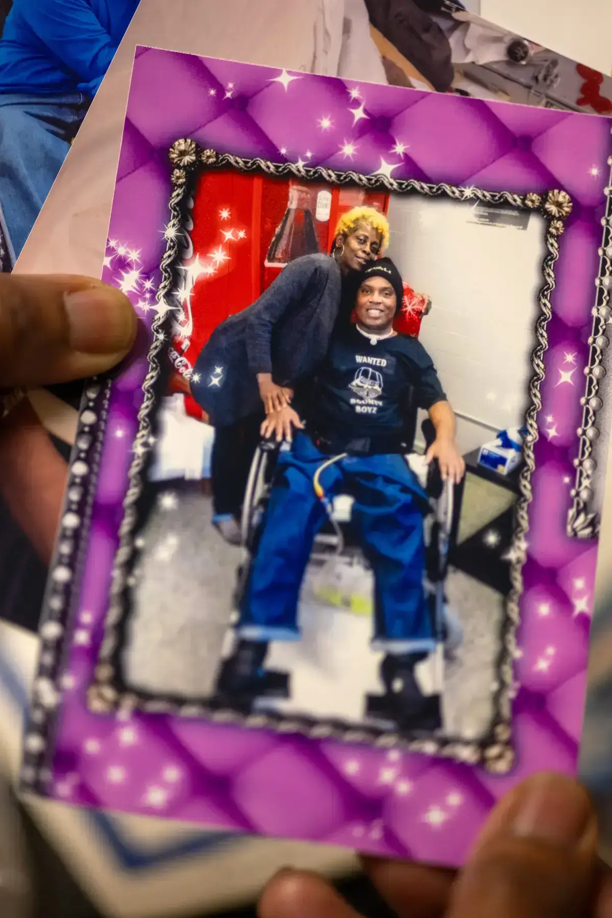 Janice holding a picture of her with her son