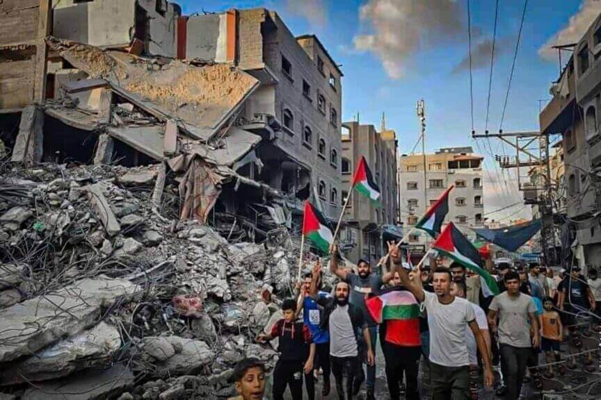 International criminal court prosecution of hamas: palestinians walk through the destruction in northern gaza.