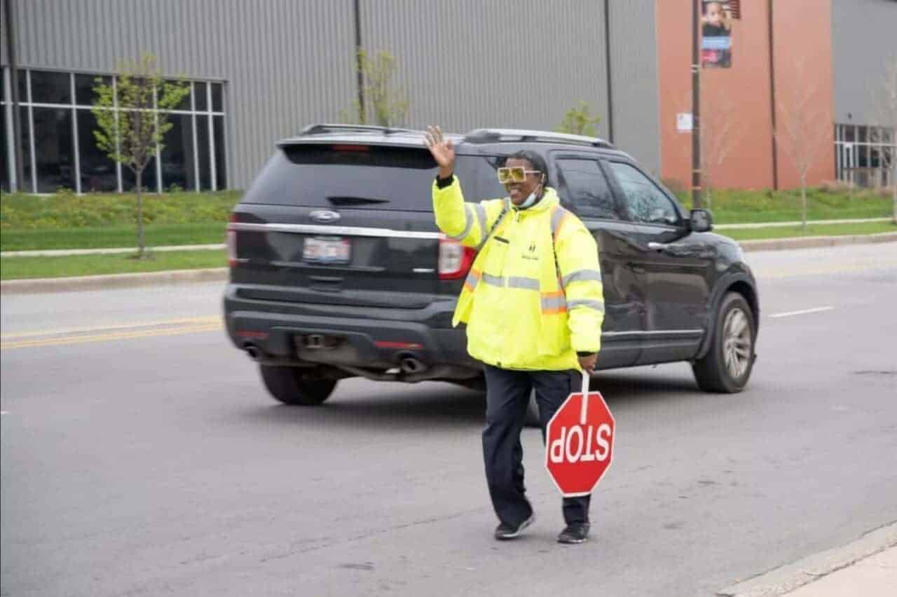 A crossing guard stops traffic in Chicago