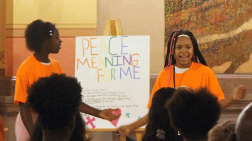 Participants of the peace camp demonstrate their dance for peace june 28, 2024, at the kansas statehouse.