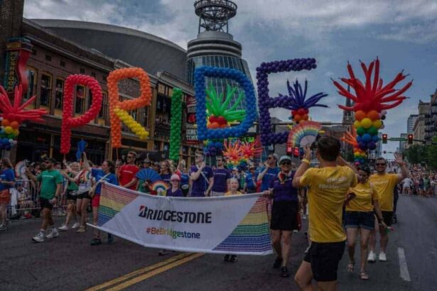 Bridgestone americas employees carry a company banner during the june 22 nashville pride parade.