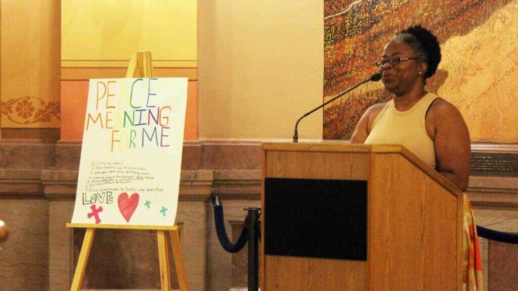 Peace campers: regina platt speaking at the peace demonstration for the topeka center for peace and justice on june 28, 2024, at the kansas statehouse.