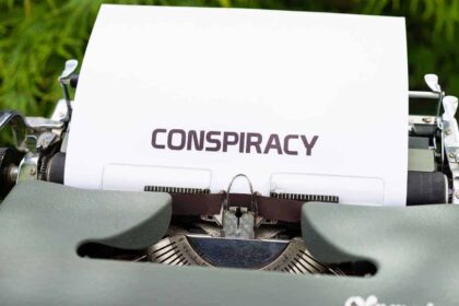 Conspiracy theories A typewriter with a piece of paper in it has CONSPIRACY typed on it.