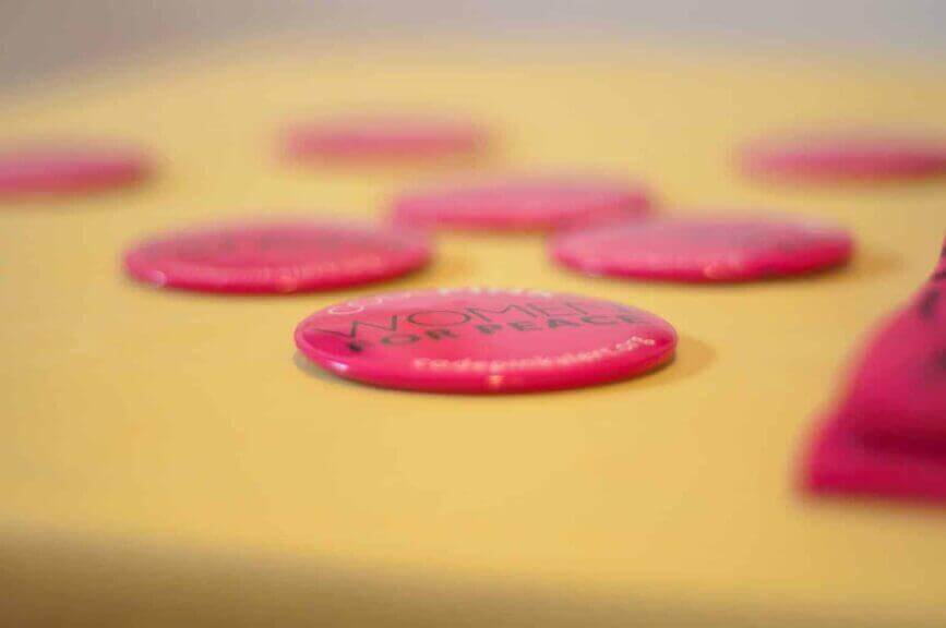 Codepink’s buttons that say “women for peace”