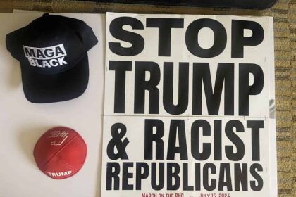 Sign that says STOP TRUMP AND RACIST REPUBLICANS