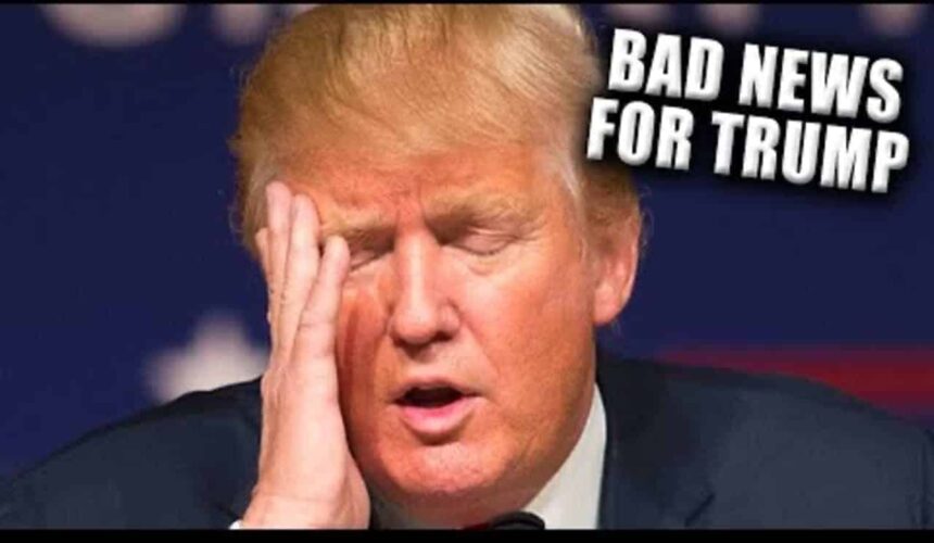 Donald trump with his head in his hand, eyes closed