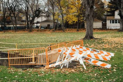 Storm drain with police tape around it