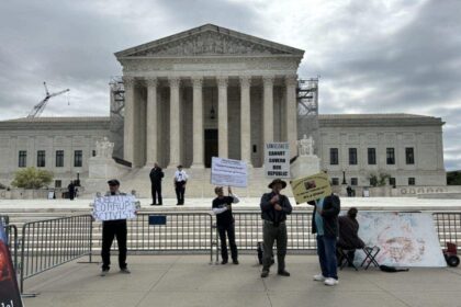 Protesters outside the U.S. Supreme Court on April 25, 2024, during oral arguments on a presidential immunity case.