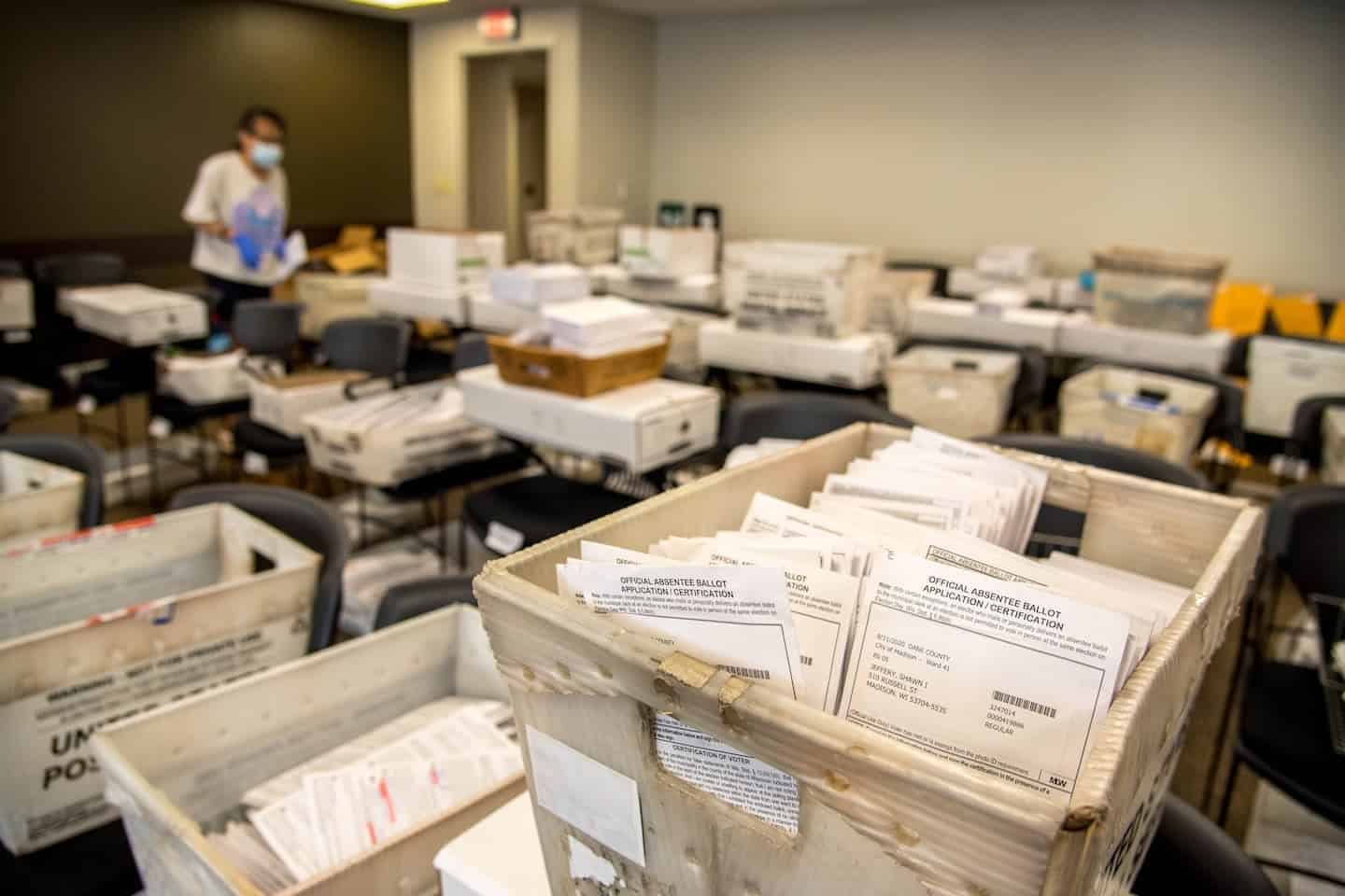 What will happen on election night? Boxes of absentee ballots are sorted by ward in a room at the Madison, Wis., City County Building on Aug. 5, 2020, ahead of the Aug. 11 election.