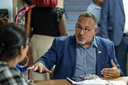 Title IX rule U.S. Secretary of Education Miguel Cardona speaks with families at the Mattie Rhodes Center in Kansas City