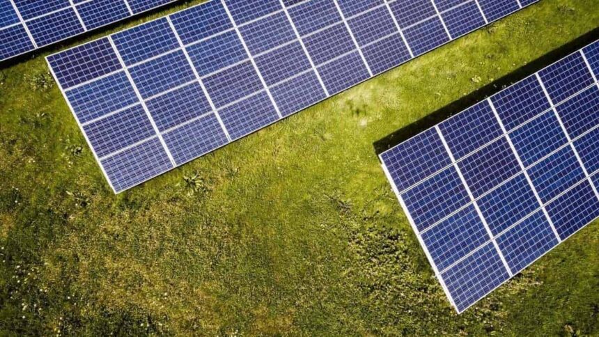 Green grass with solar panels installed