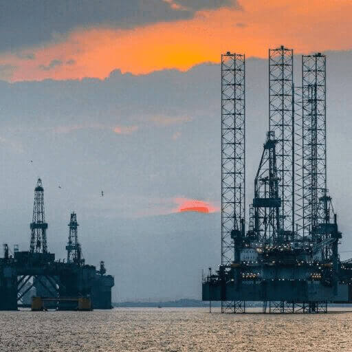 img 6776 Good news oil rigs with the setting sun in the background