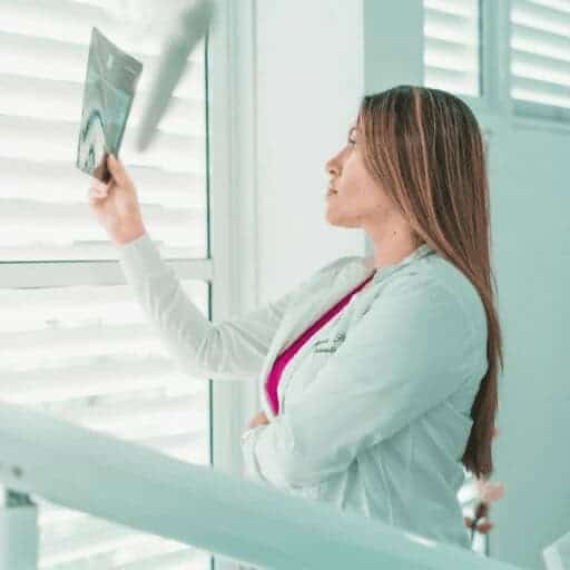 img 6777 Good news doctor holds up x-rays at a sunny window to read them