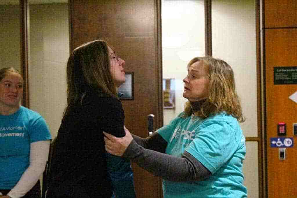 facetune 15 12 2023 14 47 05 1024x683 1 Valerie von frank (right) offers support to melissa hudecz after hudecz addresses the michigan state university board of trustees on dec. 15, 2023.