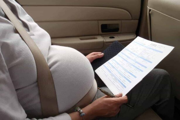A pregnant woman wearing a seatbelt in a taxi looking at paperwork from the doctor.