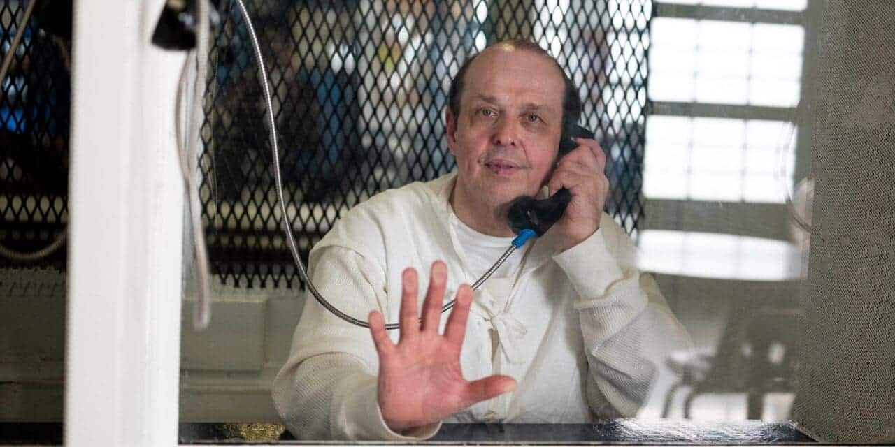 Robert roberson photographed through plexiglass at tdcj polunsky unit in livingston, texas