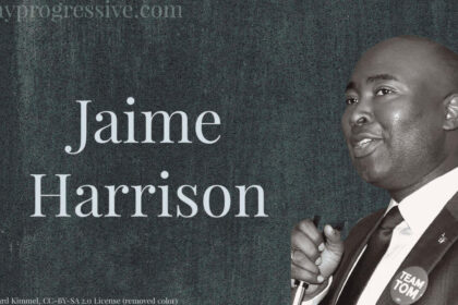 Photo of Jamie Harrison in black and white on a dark gray background