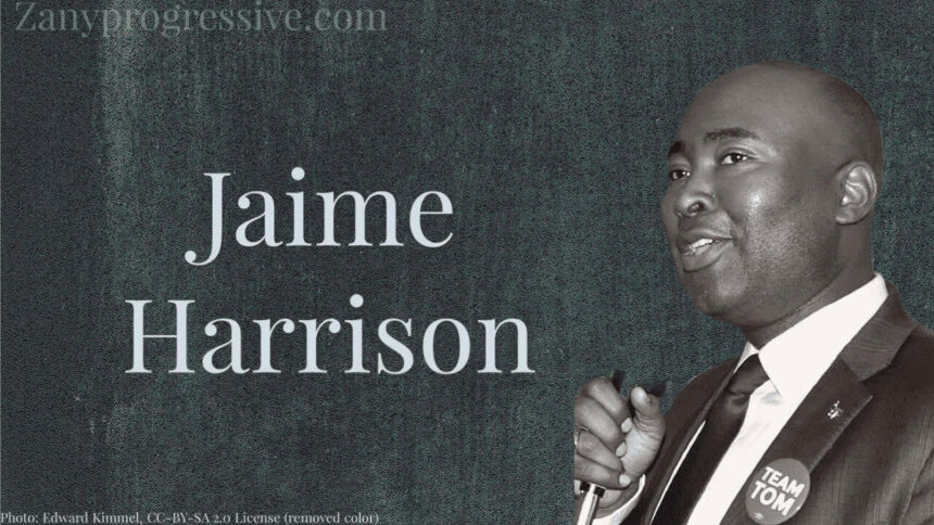 Photo of jamie harrison in black and white on a dark gray background