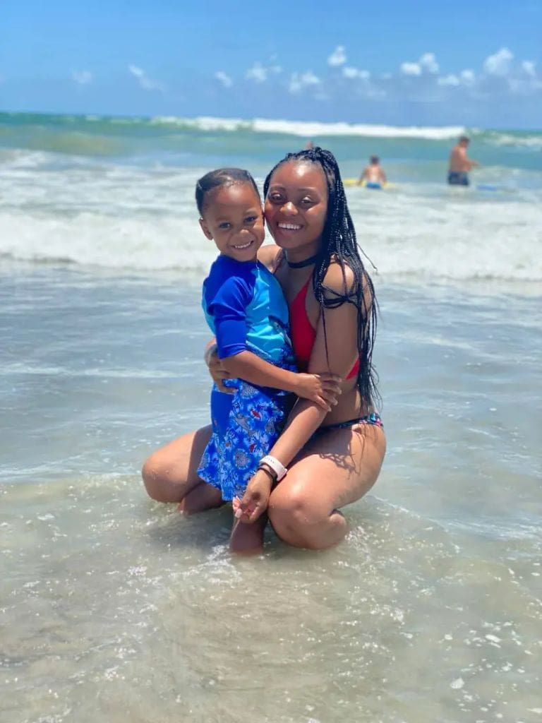 Amber thurman and her son at the beach.