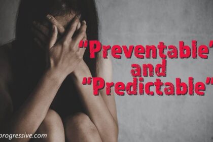 Women sitting on the floor, knees up, hands on her face crying.