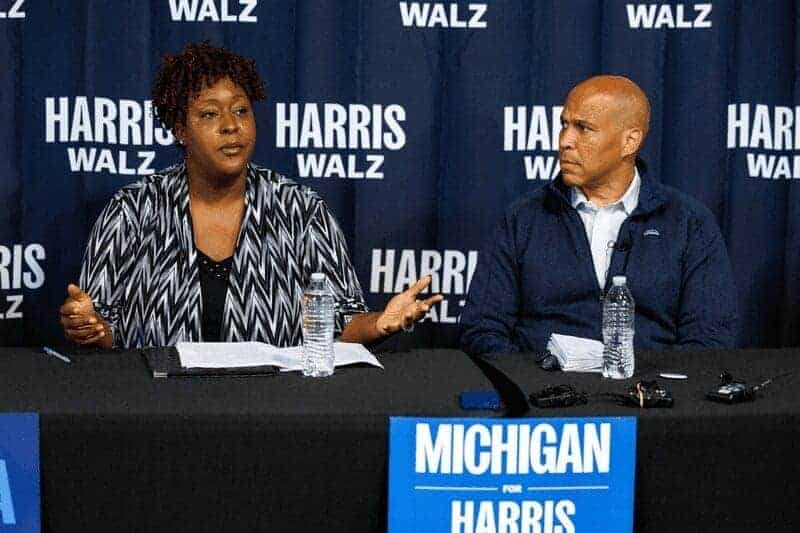 u.s. sen. cory booker (d-n.j.), right, and flint city council president ladel lewis, left, participate in a roundtable with small business owners in flint, mich., on sept. 20, 2024. U. S. Sen. Cory booker (d-n. J. ), right, and flint city council president ladel lewis, left, participate in a roundtable with small business owners in flint, mich. , on sept. 20, 2024.