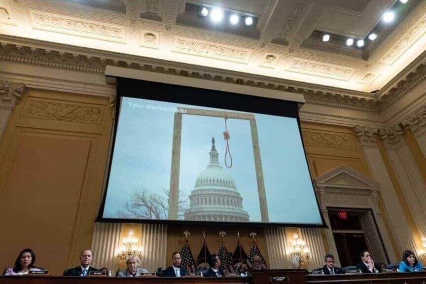 Projector at the january 6th hearings showing the gallows that was erected outside the capitol that day