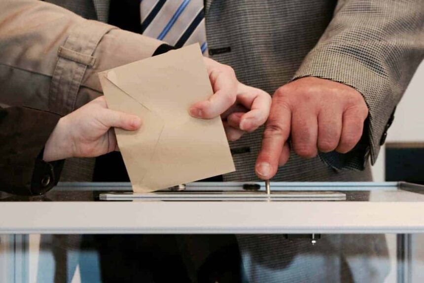Too young to vote? College students drop off a ballot