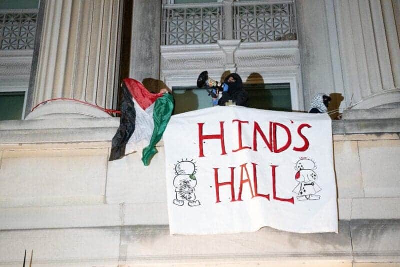 Gaza children shot.Columbia University student takeover of building draped banner outside
