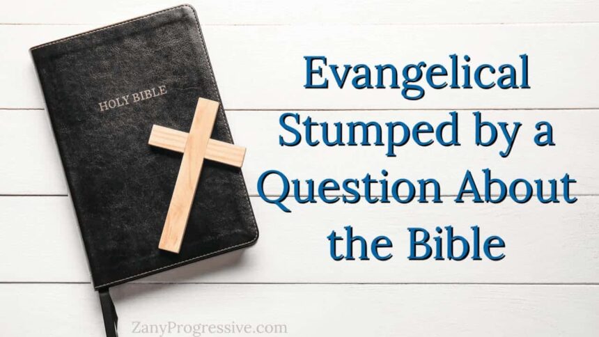 Bible on a wooden table painted white with a wooden cross laying on the bible