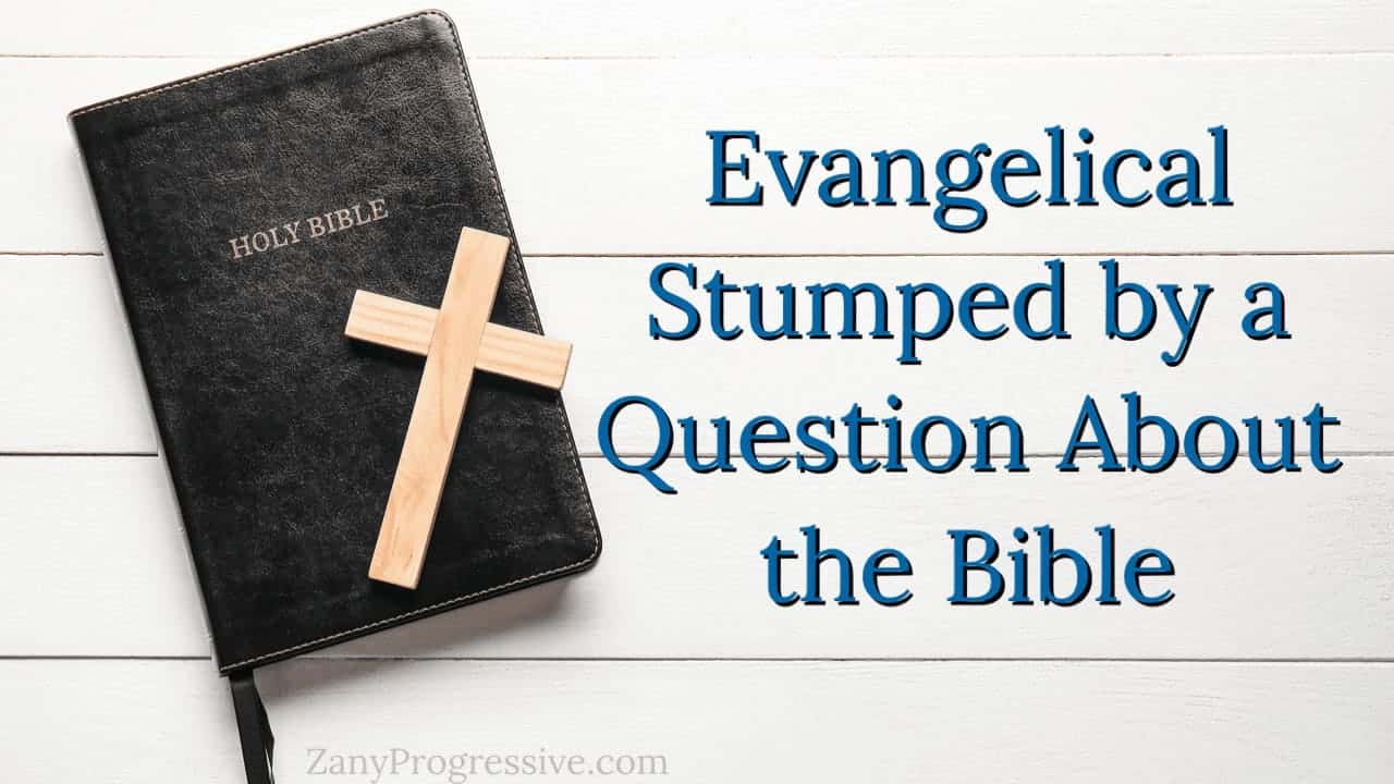 Bible on a wooden table painted white with a wooden cross laying on the bible