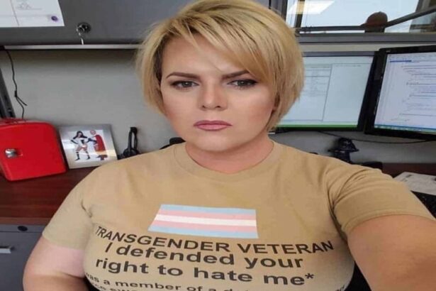Transgender veteran wearing a shirt that says i fought for your right to hate me