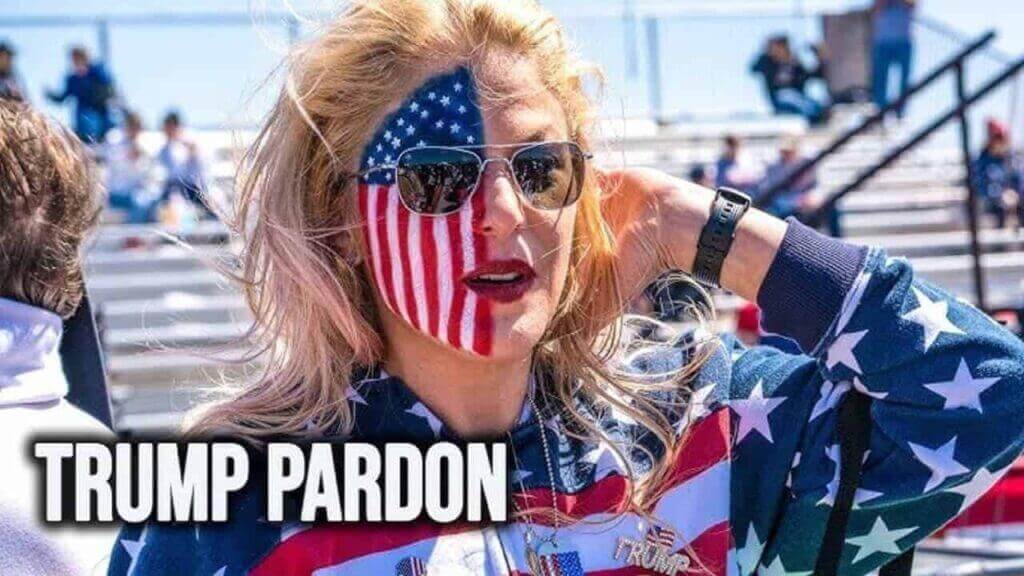 A trump supporter with half of her face painted as an american flag