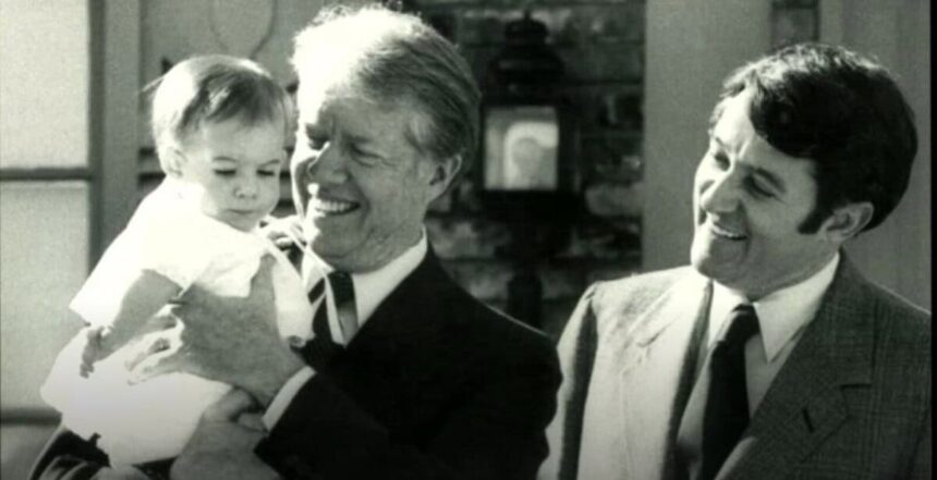 Jimmy carter holding mayor larry wade's daughter, elizabeth in 1979 during a visit to elk city, ok.