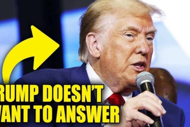 Donald trump holding a microphone