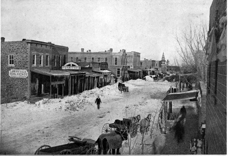 Snow-covered street in Kansas in the 1800s