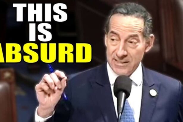 Jamie raskin speaking at the mic on the house floor holding a pen.