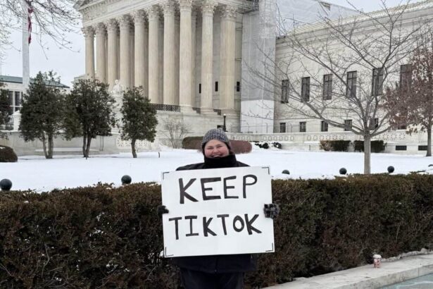Woman holding a sign in front of the supreme court that says keep tiktok
