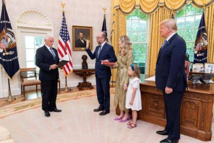 Russell Vought being sworn in during the first Trump Administration