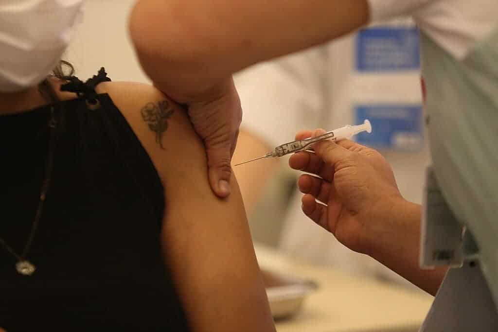 Woman getting vaccinated