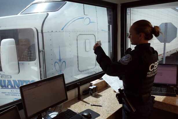 A u. S. Customs and border protection officer checks the identification of truck driver as he passes through the u. S. Checkpoint of the cargo pre-inspection at the otay mesa, calif. , port of entry, june 22, 2016. On any given day, several hundred trucks line up on the mexican side of the border to deliver imports ultimately awaiting the process of screening by customs officers.
