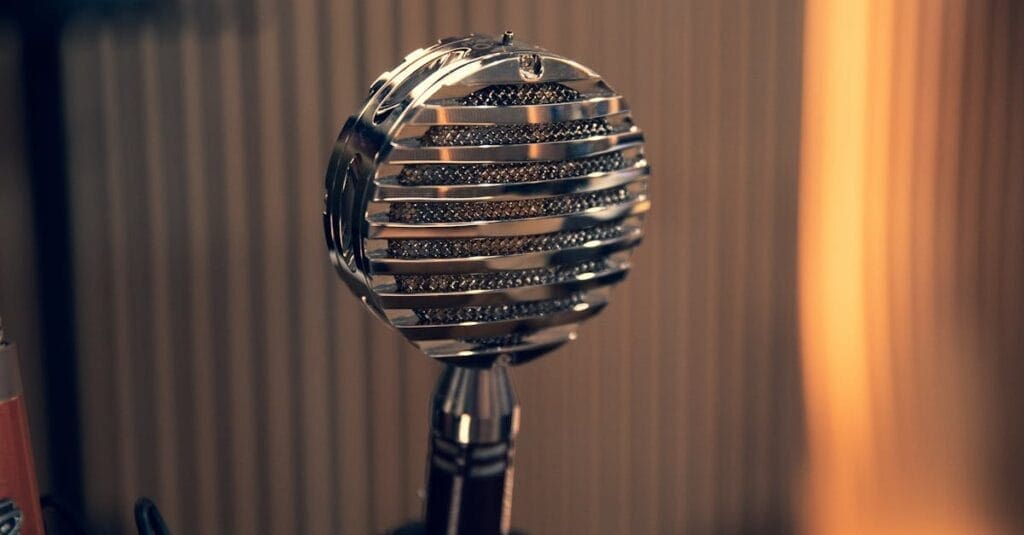 Close-up of a vintage microphone with a striped background in a studio environment.