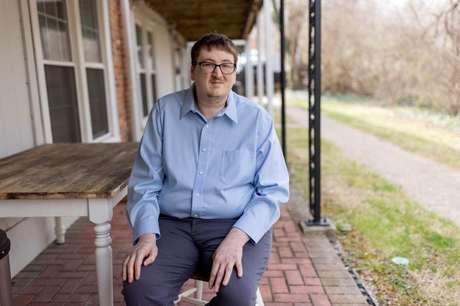 eric wunderlin on porch Eric sits on porch to discuss medicaid work requirements
