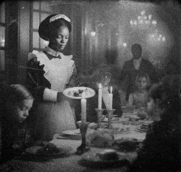 black maid Black laws. A black maid serving dinner