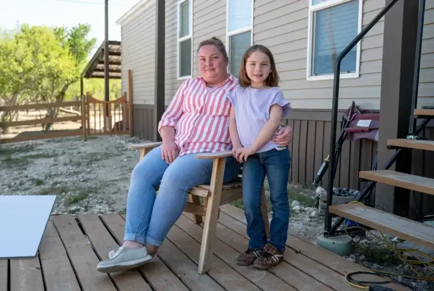 mother daughter on front porch People prefer basic resources over border security. Mother and daughter sitting on their front porch