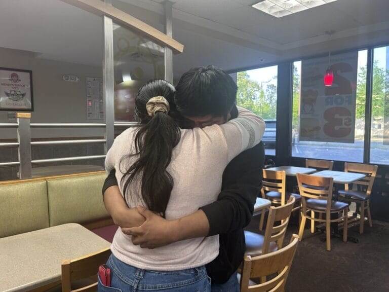 US citizen released from jail hugs his mother