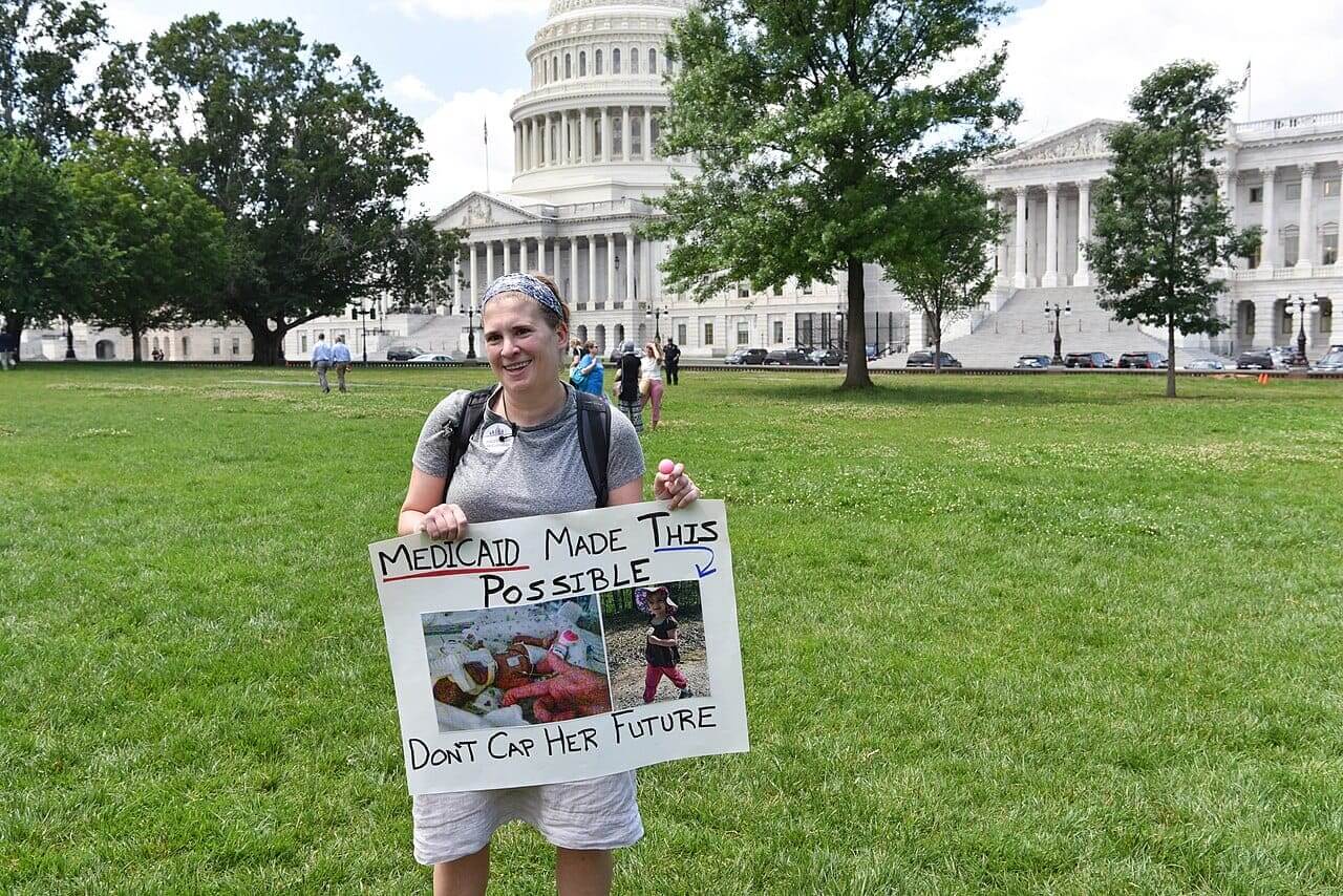 Medicaid protest sign