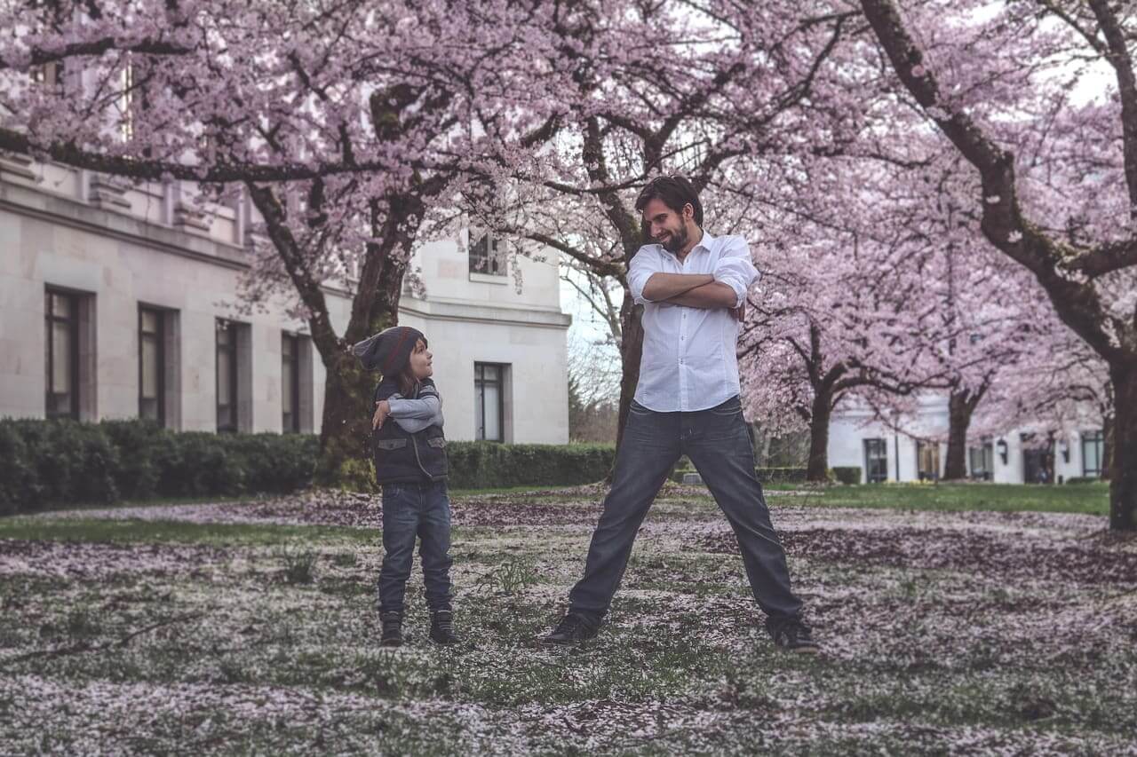 Father and child goofing around outside