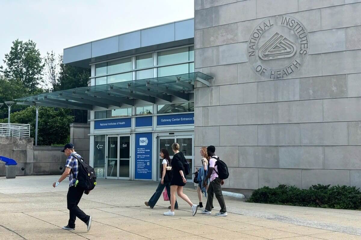 People walking by the entrance to the nih entrance