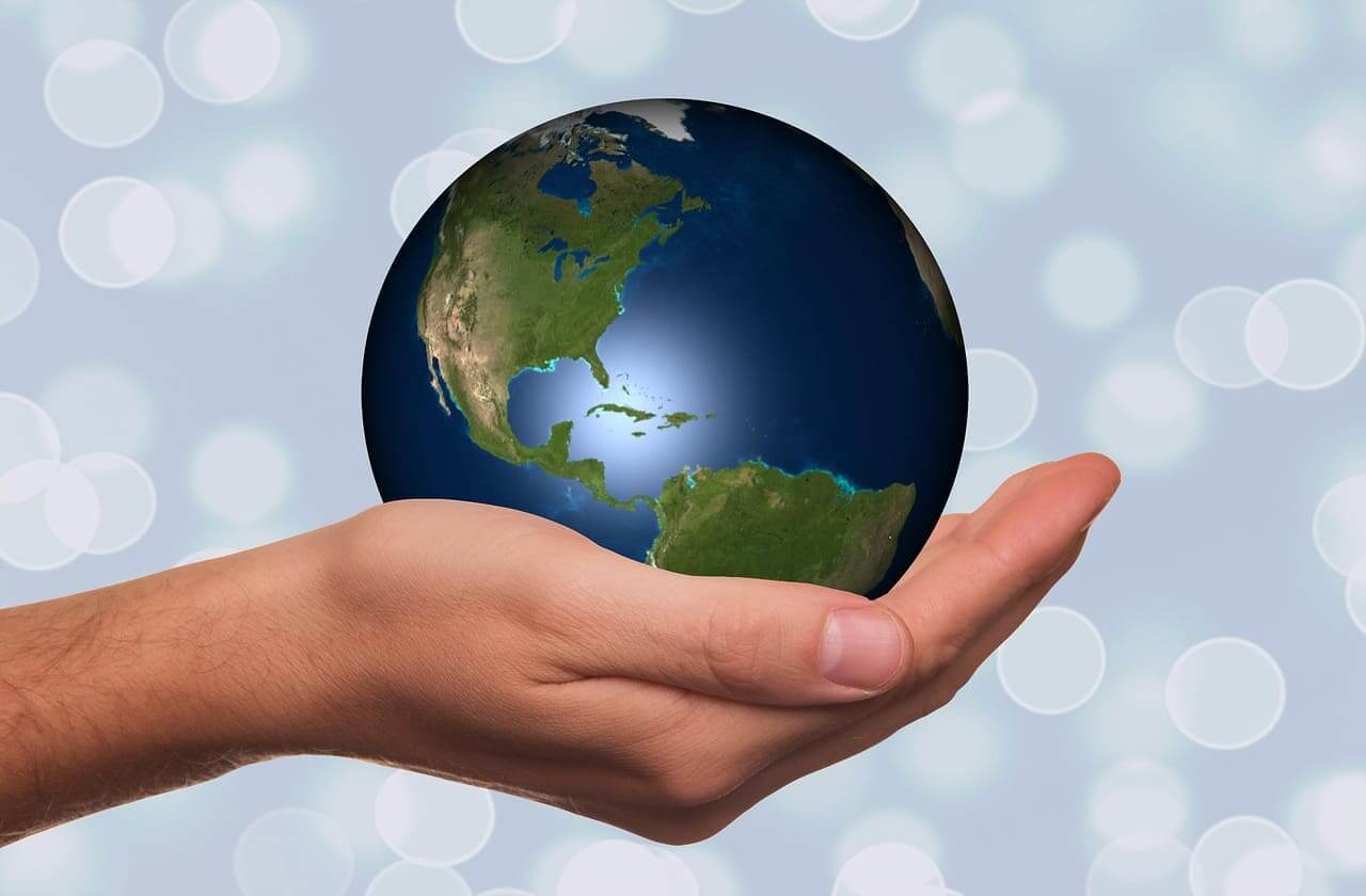 Environmental activities for kids. Global south, a hand holding the planet