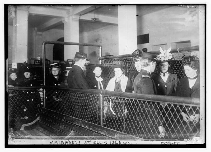 Guan heng is like the people in this photo of immigrants arriving at Ellis Island in the 1900’s.